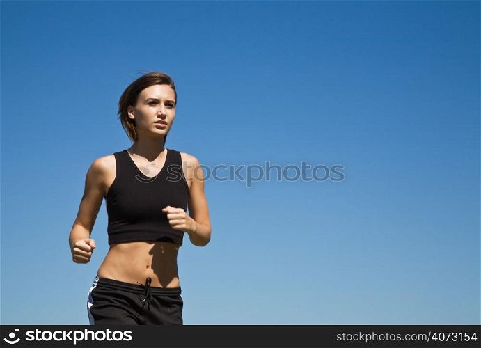 A shot of a caucasian girl running outdoor