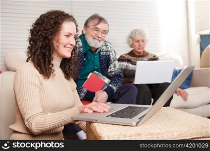 A shot of a family spending time at home with laptop