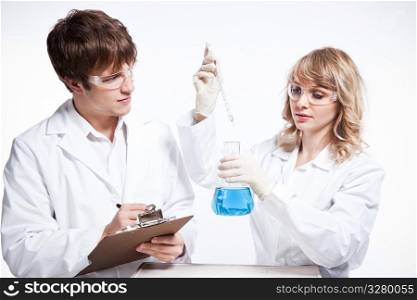 A shot of a male and female caucasian scientists