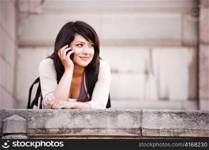 A shot of a mixed race student talking on the phone