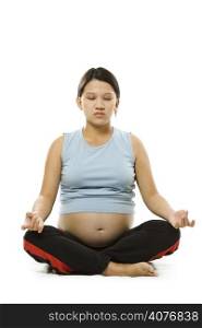 A shot of a pregnant asian woman doing relaxation by meditating