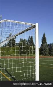 A shot of a soccer goal posts on an sport field