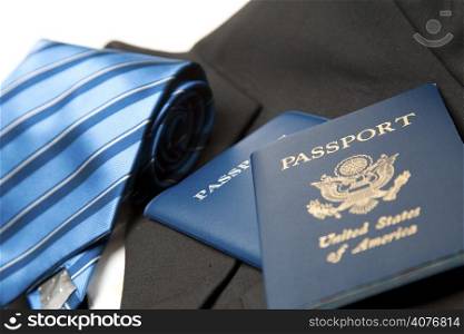 A shot of a suit and tie and passports, can be used for business travel concept