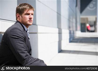 A shot of a thinking confident caucasian businessman
