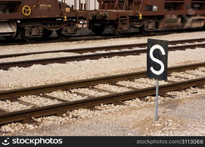 A shot of a train station with the &acute;stop&acute; sign (S). Podgorje, Slovenija