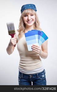 A shot of a woman choosing paint colors