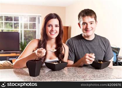 A shot of a young couple eating breakfast