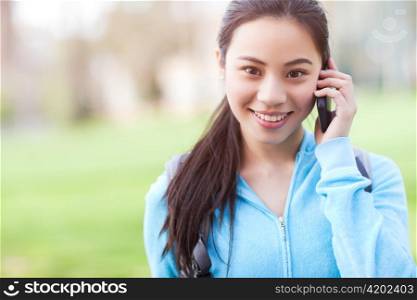 A shot of an Asian student talking on the phone