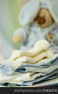 A shot of baby clothing and doll at a nursery