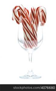 A shot of christmas candy cane in a wine glass