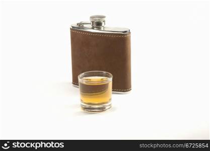 a shot of rum in front of a Petak