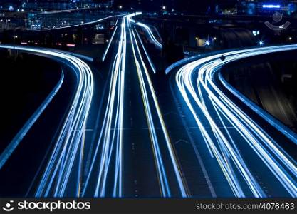 A shot of rush hour traffic on a bridge in blue tone