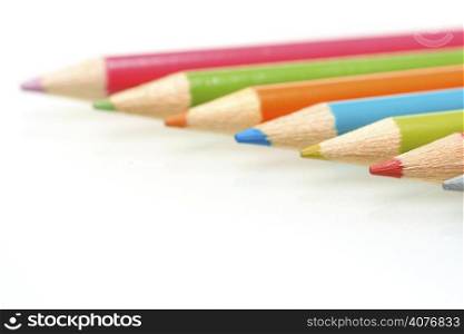 A shot of variety of color pencils in a row