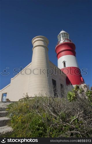 A side view of the lighthouse at Cape Agulhas showing one of the two tower.