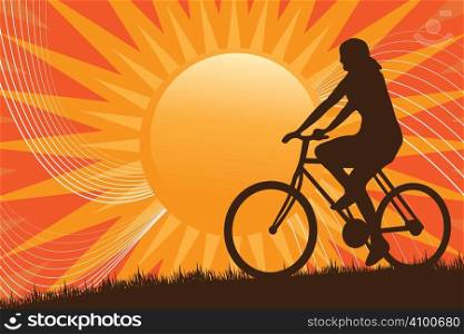 A silhouette of a person riding a bike in front of the sun.