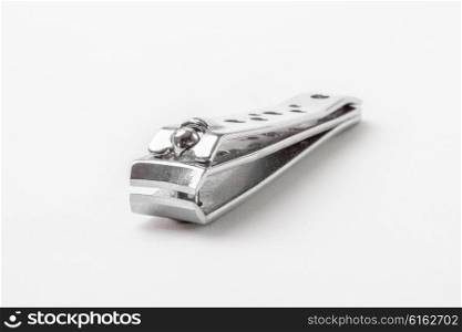 A Silver Nail Clipper on a White Background