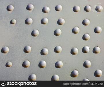 A silver painted metal aircraft background with rivets.