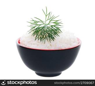A simple bowl of rice delicately garnished with a feathery sprig of dill. Shot on white background.