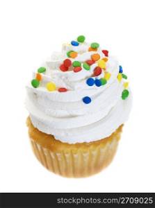 A single cupcake heaped with icing and colorful candy sprinkles. Shot on white background.