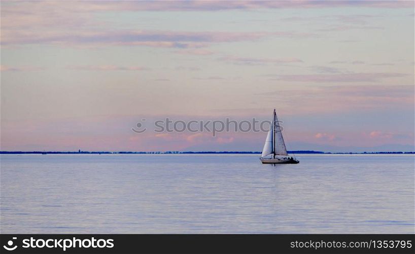 A single sail in the bay of Trieste