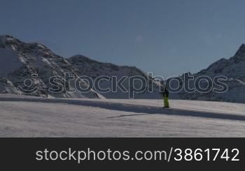 A skier walking in the snow