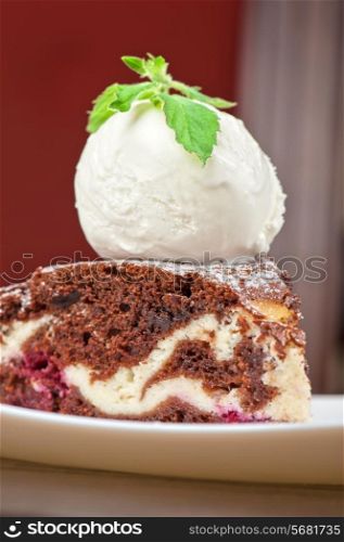 A slice of chocolate cake with ice cream