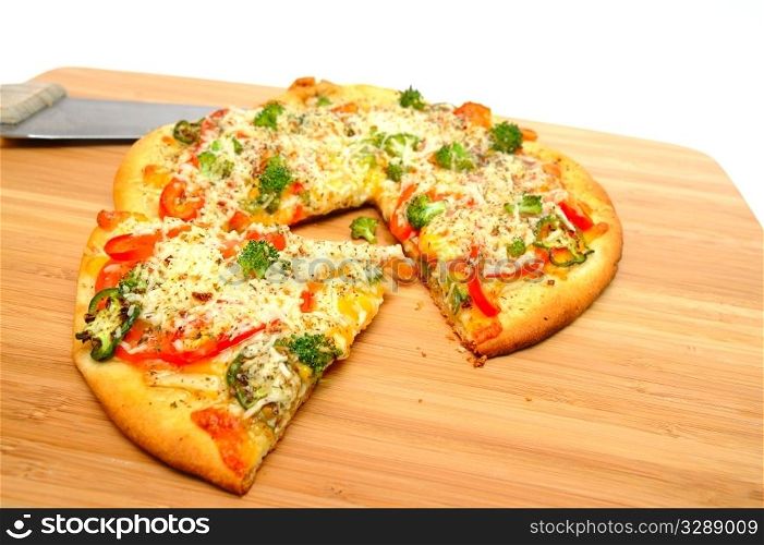 A slice of gourmet veggie pizza topped with sharp cheddar and asiago cheese, fresh tomatoes, red bell pepper, mild jalapeno chilie, broccoli and dried herbs. Gourmet Veggie Pizza