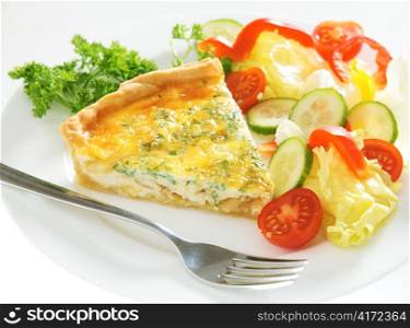 A slice of homemade cheese, onion and parsley quiche with salad and a fork on a plate