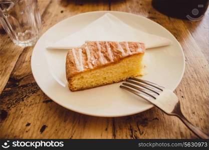A slice of lemon drizzle cake