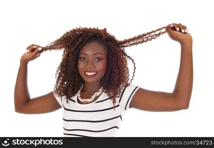 A slim gorgeous young woman in closeup, standing from front and pulling her hair, smiling, isolated for white background.