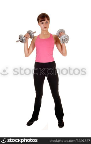 A slim teenage girl with dumbbells doing some weight lifting in the studioas exercise to stay fit, for white background.