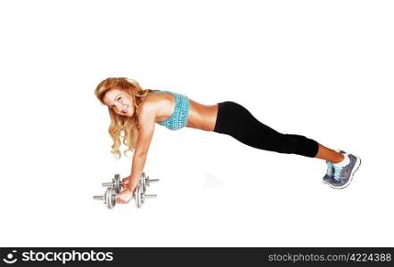 A slim young woman doing gymnastic in the studio with her dumbbells?,in a blue sports bra and black pants, for white background.