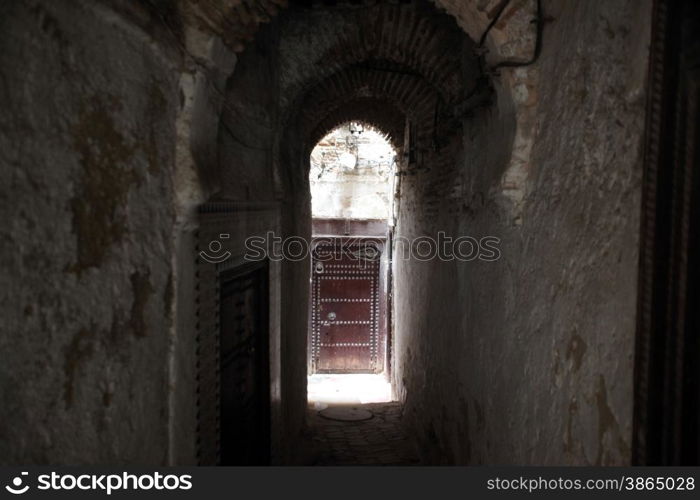 a smal Marketroad in the Medina of old City in the historical Town of Fes in Morocco in north Africa.. AFRICA MAROCCO FES