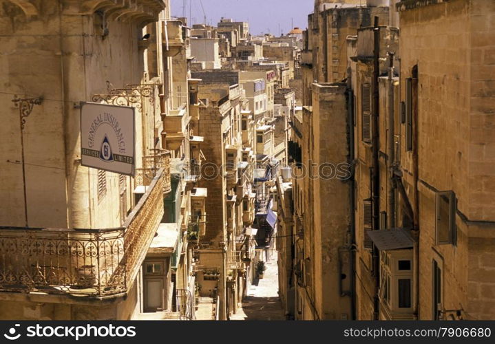 A smal road in the centre of the Old Town of the city of Valletta on the Island of Malta in the Mediterranean Sea in Europe.&#xA;