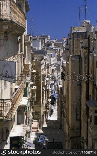 A smal road in the centre of the Old Town of the city of Valletta on the Island of Malta in the Mediterranean Sea in Europe.&#xA;