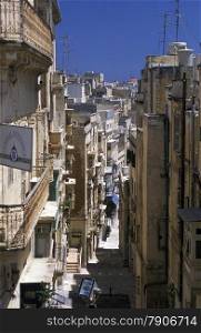 A smal road in the centre of the Old Town of the city of Valletta on the Island of Malta in the Mediterranean Sea in Europe.&#xA;