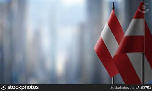 A small Austria flag on an abstract blurry background.. A small Austria flag on an abstract blurry background