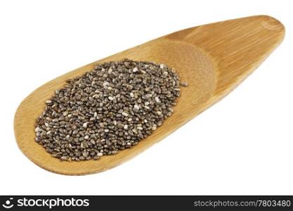 a small bamboo scoop of chia seeds, isolated on white