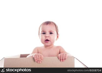 A small child crawls out of the box isolated. Baby and the box