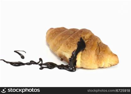 a small chocolate croissant filled with liquid