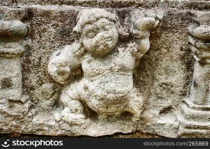 A small detail of a man carved into stone from a frieze on the outside of the Vatadage dagoba has been eroded over centuries by the rain in the ancient city of Polonnaruwa in Sri Lanka.