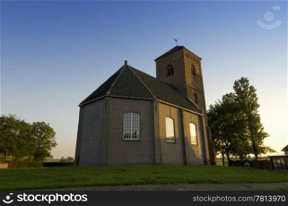 A small monumental coutry chapel in the middle of the rural Dutch polders near Spaarndam