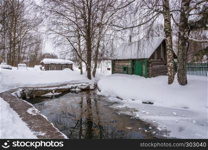 A small pond on the Holy Mother of God spring on a winter day in the village of Vyatskoe, Yaroslavl Region, Russia.