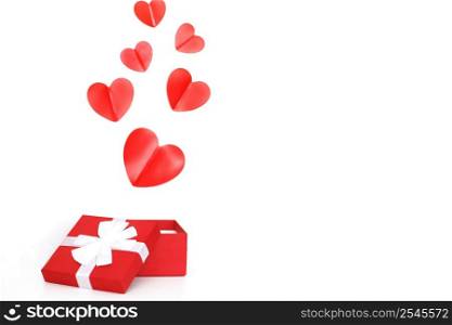a small red present box with red hearts on a white background. red present box with red hearts on a white background