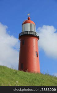 A small vintage lighthouse at the North Sea Coast