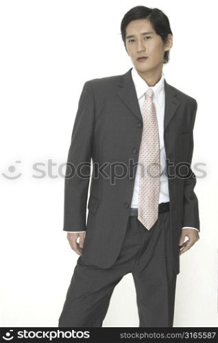 A smart and sophisticated businessman in a grey suit