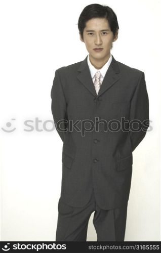 A smart asian businessman in a grey suit