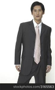 A smart asian businessman in a suit