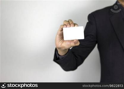 A smart Man holding mock-up white card on white background, a business man wearing dark suit and his hand holding white card