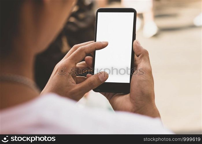 A smartphone with an empty screen in a man's hand, mockup phone.